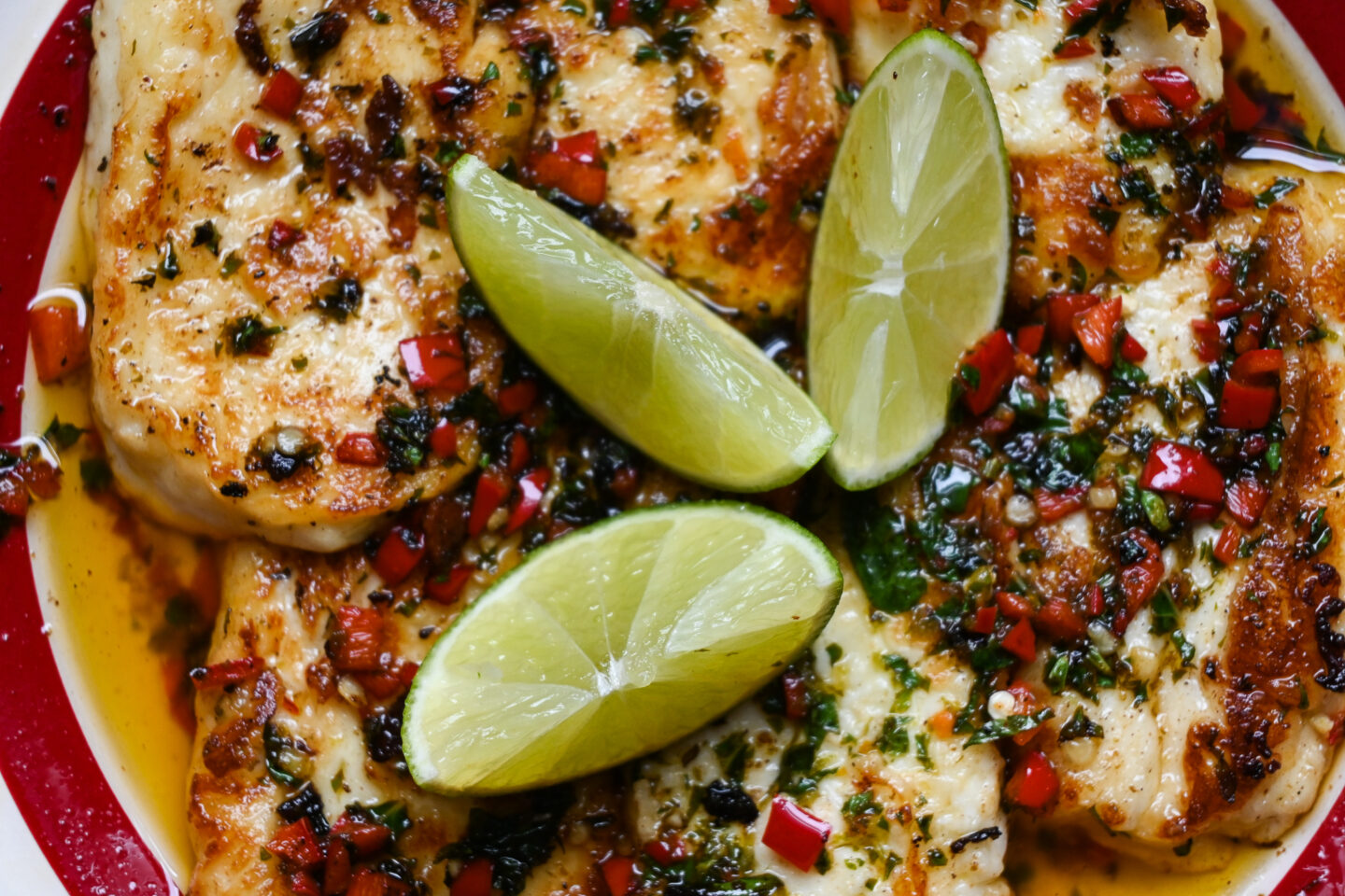 Sliced & fried halloumi with a Lime, chilli & mint olive oil glaze topped with fresh lime wedges - Closeup shot