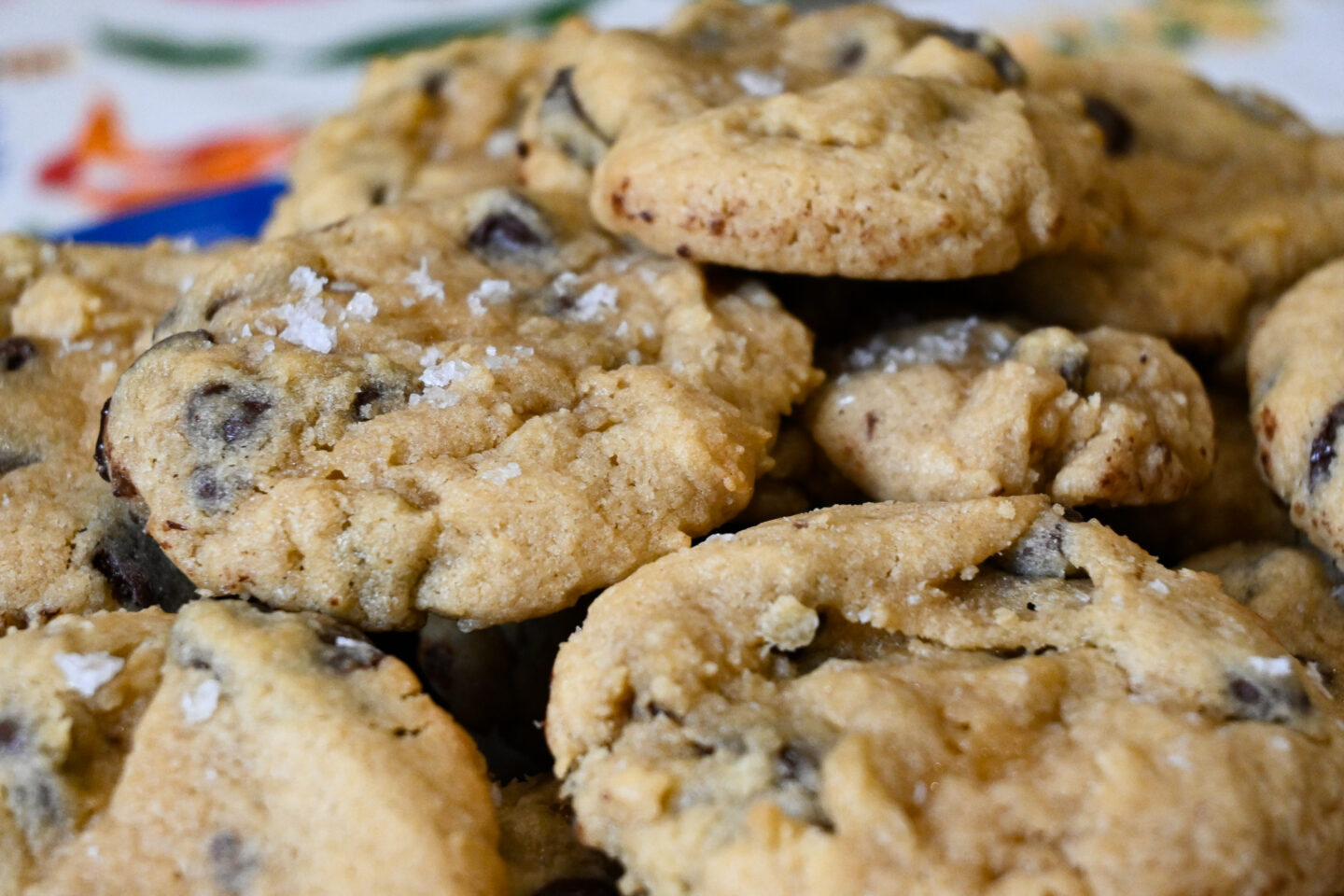 Closeup of chocolate chip cookies with sea salt flakes sprinkled on top