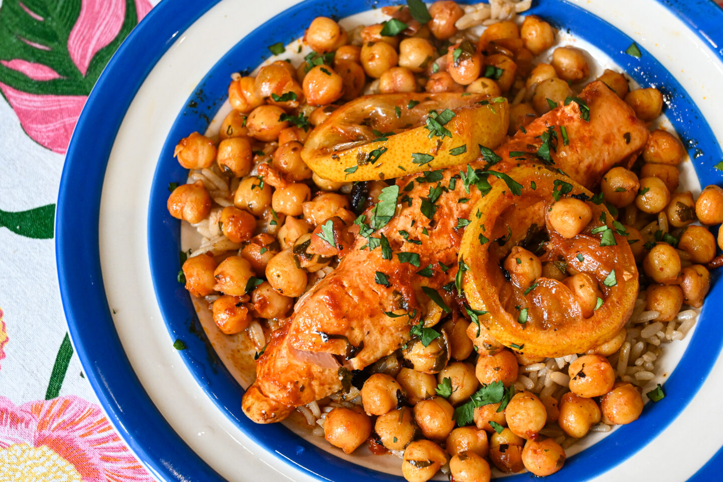 Harissa Salmon, Lemon & Chickpeas en Papillote with brown rice on a blue & white striped Cornishware plate