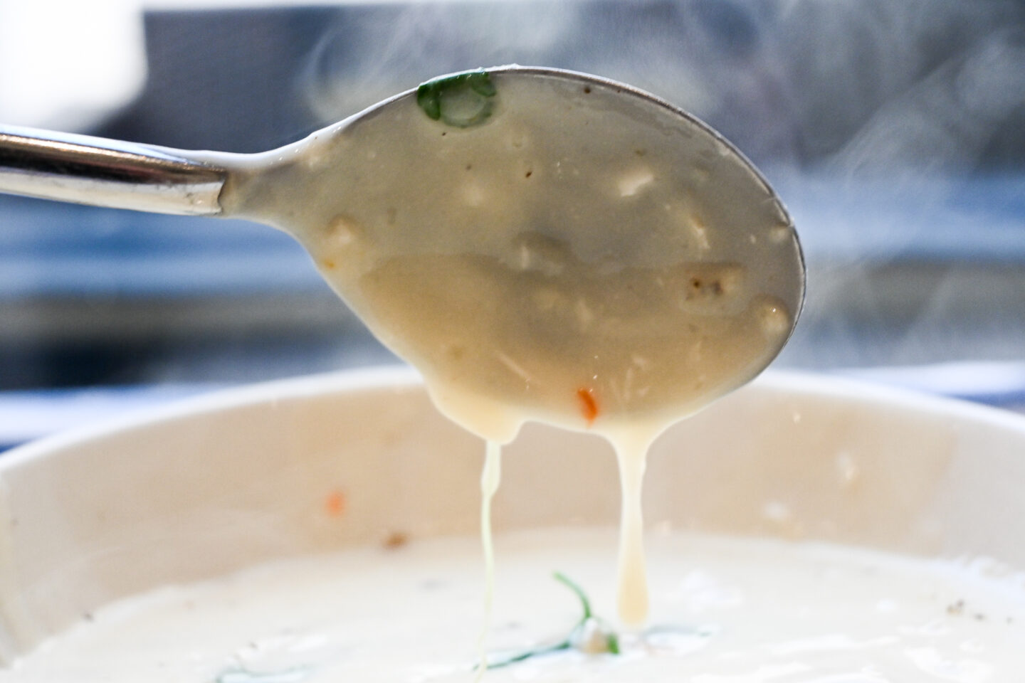 Coated spoon to show thickness of the cream of chicken soup.