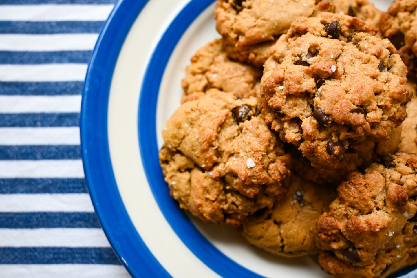 Flourless Peanut Butter & Chocolate Chip Cookies on a blue & white Striped Plate