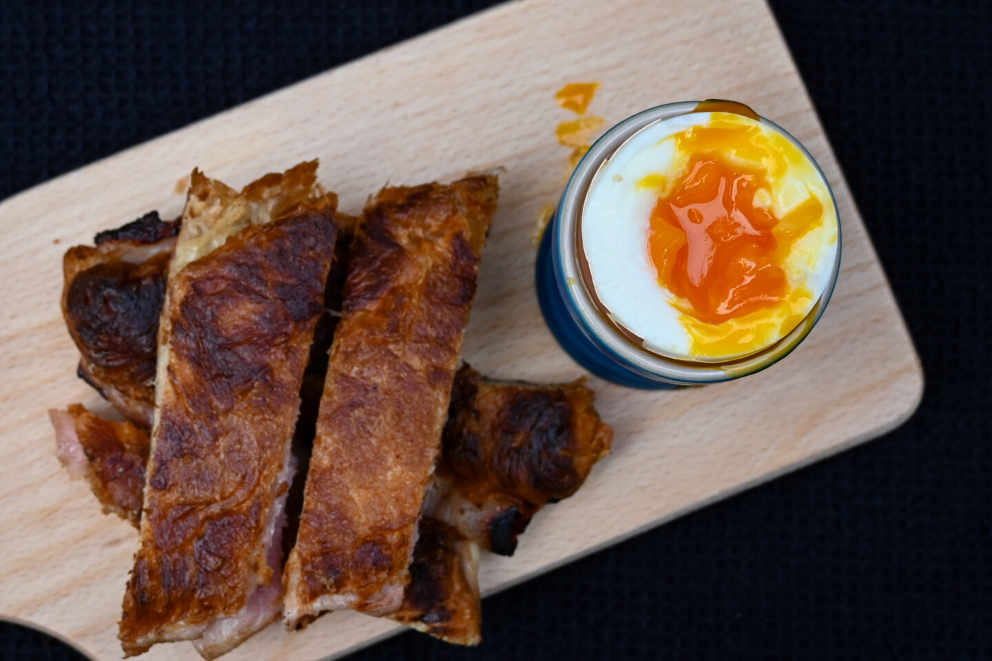 Closeup of orange yolk in soft boiled egg - shot taken from above