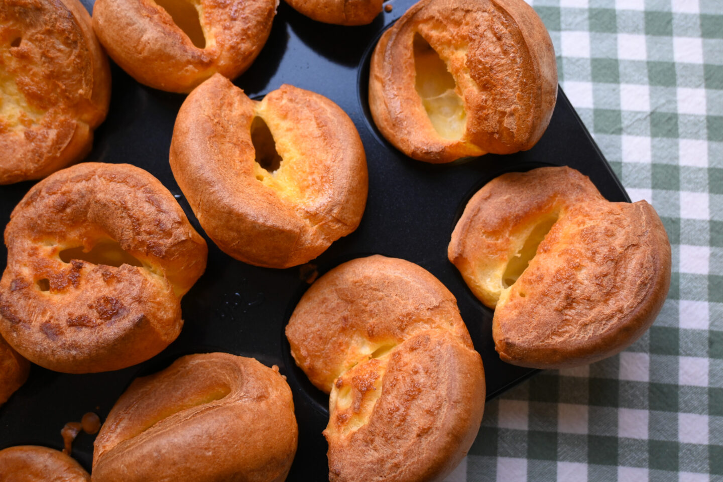 Closeup of miniature yorkshire puddings in muffin tray